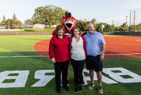 At a dedication ceremony for the 垒球 field named in her honor, Barbara Madrigrano (right) st...